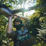 drones soldier holding pre launch drone in forest 676x450 219332